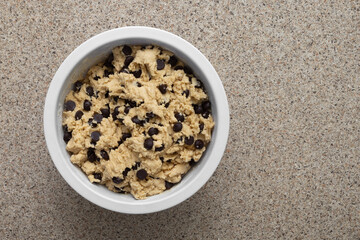 Chocolate chip cookie dough in mixing bowl with copy space