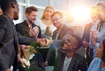 Image employers in office shaking hands after successful negotia - obrazy, fototapety, plakaty