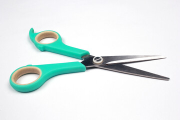 Green tosca scissors isolated on white background.