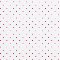 White sheet of paper with pink polka dots. For use as a background or texture. © roobcio