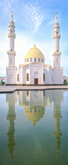 White Mosque, Bolgar, Tatarstan. A beautiful white mosque with domes and minarets against a bright blue sky.