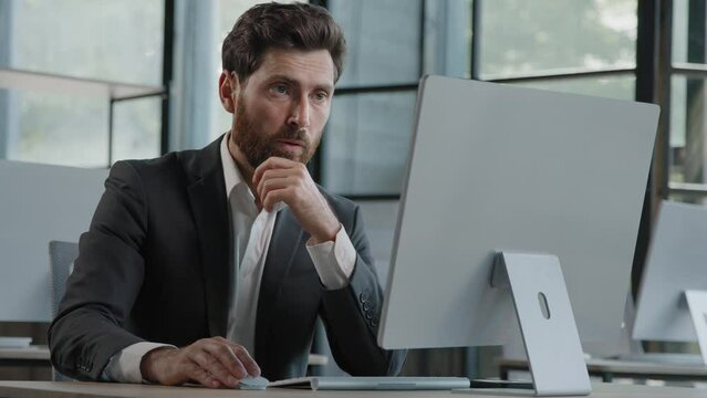 Caucasian bearded 40s middle-aged businessman worker employee man typing laptop feel failure upset with lost of information online error stressed look at computer screen suffer from headache pressure