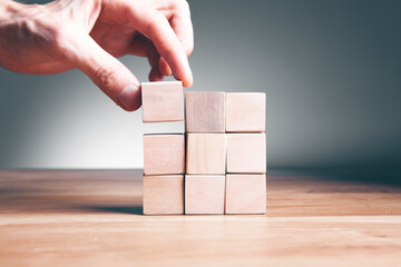 wooden cubes on top of each other