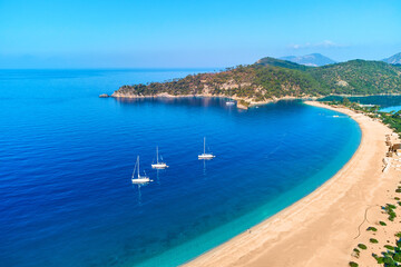 Fototapeta na wymiar Drone photo of sailing yachts in the mediterranean azure sea