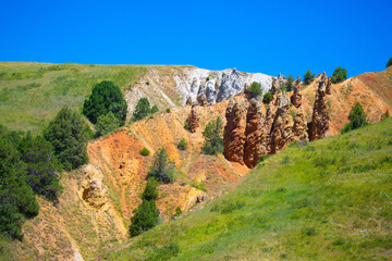 The natural unusual landscape of the Red Rocks of extraordinary beauty is similar to the Martian landscape. Tale of colorful canyon in Kyrgyzstan. Amazingly beautiful landscape.