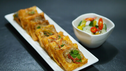 Deep Fried Minced Pork Toast, toast dip vegetable coriander and pork spread on top, Thai Chinese cookery nutrition food for restaurant and home kitchen