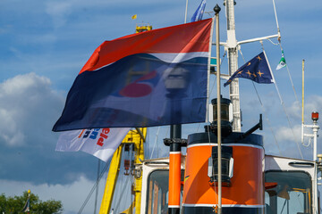 20220903.World harbour days Rotterdam. Flag on the tug.