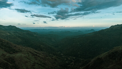 Beautiful mountain landscape with green mountains and blue sky.