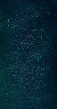 Particles texture background. Blur glitter swirl. Bokeh sparkles flow. Defocused blue orange color shimmering dust dark abstract overlay. Vertical video. Shot on RED Cinema camera.