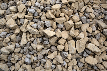 Building gravel, crushed stone, rock pieces. Construction material. Closeup texture and background, gray color. .