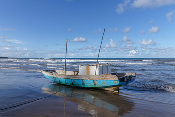 Fototapeta na wymiar boat on the beach in the city of Ilheus, State of Bahia, Brazil