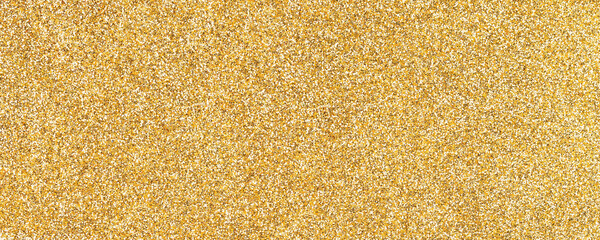 Abstract golden sparkling shiny background from small sequins, macro. Glitter yellow backdrop