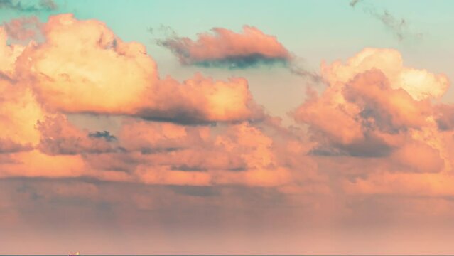 Flying clods and sun beams at colorful sunset. 4K time-lapse