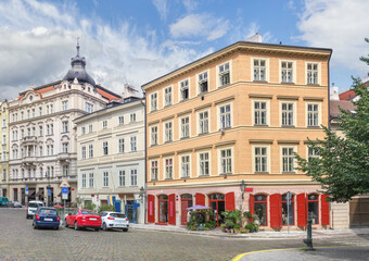 Fototapeta na wymiar Beautiful old houses on Hastalska street in the historical center of Prague. Czech Republic