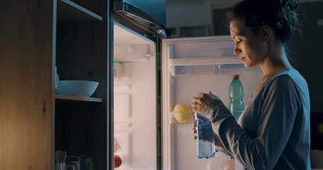 Thirsty woman drinking fresh water