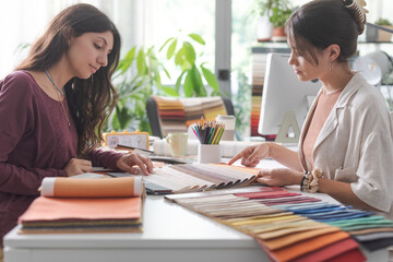 Interior designer and customer checking swatches