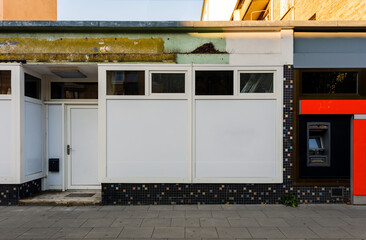 closed or locked shop in the urban city, closed down store or shop as town goes into recession and...