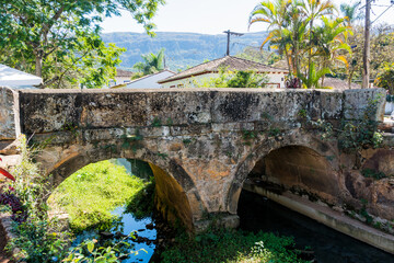 Fototapeta na wymiar Old bridge over one river photographed in a travel in the State of Minas Gerais, Brazil.
