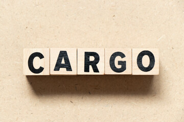 Alphabet letter block in word cargo on wood background