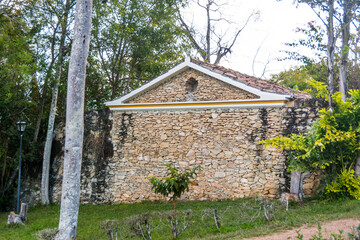 Fototapeta na wymiar Old stone house in a park at Tiradentes, State of Minas Gerais, Brazil.