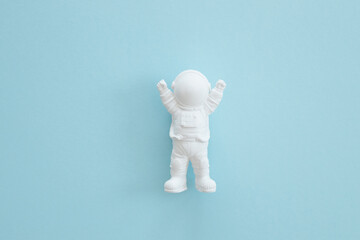 plaster figure of an astronaut on a blue background