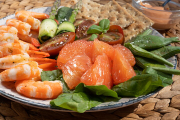 Salad of shrimp, mixed greens. A healthy green garden salad with cooked shrimp