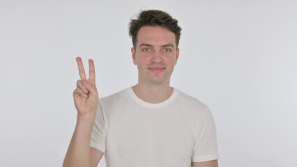 Fototapeta premium Victory Sign by Young Man on White Background
