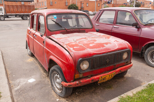 Bogota, Colombia - 05 Nov 2010: An old red car, rusted and abandoned on a street in Mosquer, near Bogota