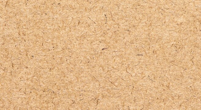 OSB panel, top view. Industrial wall sheet. Plywood brown texture. Cork background. Wood natural grain pattern. Light wood surface. Floor OSB block. Building material board. Loft wall surfaces.