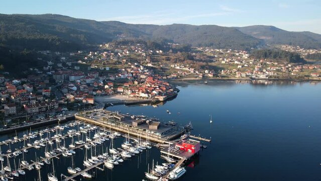 A port in Combarro, Galicia full of boats and a beautiful view of the city