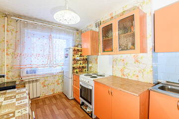 Russia, Moscow- May 21, 2020: interior apartment kitchen and dining room, refectory area cooking equipment, table furniture stove