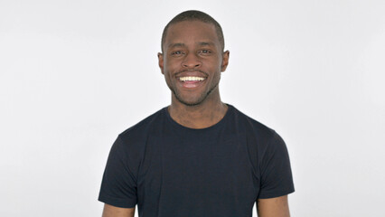 Obraz premium Young African Man Smiling at Camera on White Background