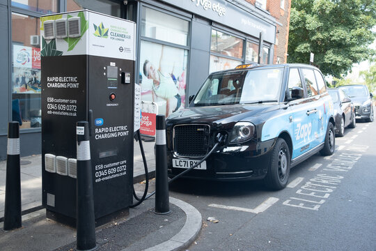 London-  London electric taxi at a Rapid Electric Charging Point off Streatham High Road in south west London