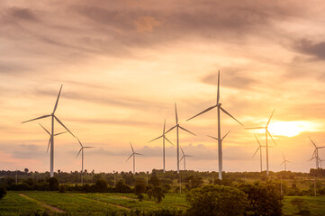 Background of wind turbines fields at sunset , ecological conservation concept