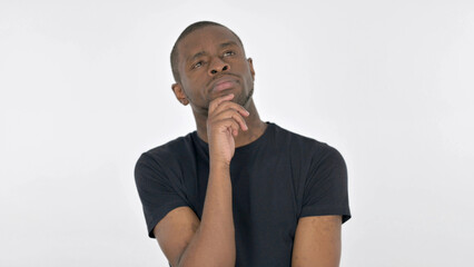 Pensive Young African Man Thinking an Idea on White Background