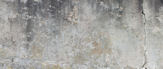 old concrete wall with crack background. Aged cracked dirty wall for photography background or urban banner design