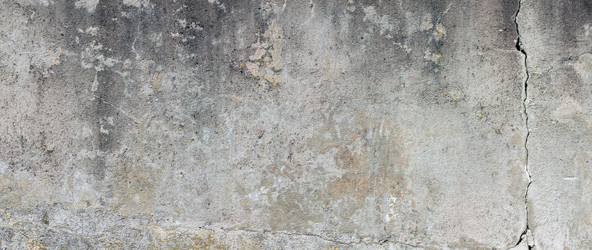old concrete wall with crack background. Aged cracked dirty wall for photography background or urban banner design