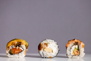 Set of sushi rolls isolated on grey background