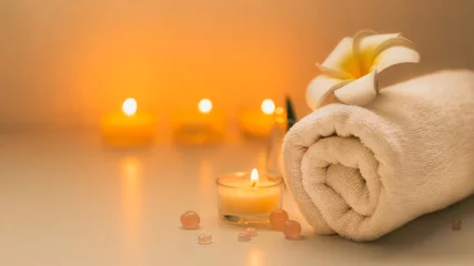 Foto op Canvas Still life spa setting with pink stone aroma scent candle and plumeria flower. Thai spa massage. Spa treatment cosmetic beauty. Aromatherapy care relax wellness. Aroma and salt scrub healthy lifestyle © butsaya33