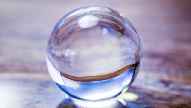 Cinemagraph of a glass globe on table
