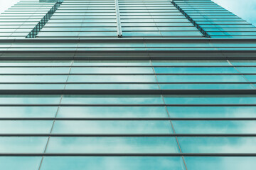 underside panoramic and perspective view to steel blue glass high rise building skyscrapers, business concept of successful industrial architecture