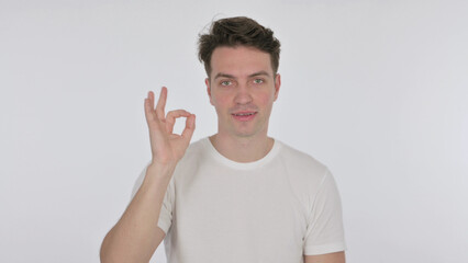 Ok Sign by Young Man on White Background