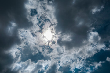 Texture of a blue sky with gray clouds