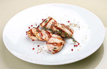 Grilled chicken breast on white background
