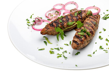 Pork kebab with greens. Isolated on a white background