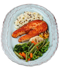Grilled salmon steak with brown rice and vegetables.