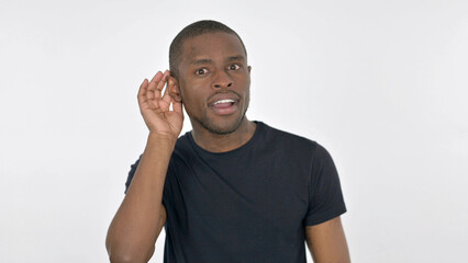 Young African Man Listening Secret on White Background