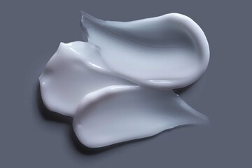 Face or body cream hair balm beige orange background