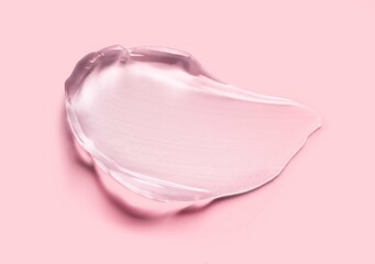 Cosmetic gel isolated on pink peach pastel beige background smudge 