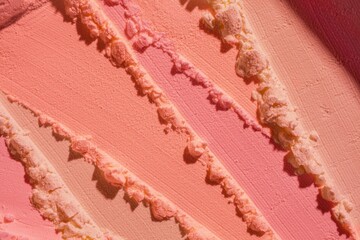 Blusher or pressed powder pink orange peach textured background